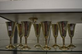 A set of eight silver plated goblets.