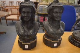 A pair of Victorian cast iron busts of ladies.