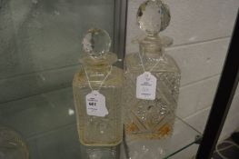 Two cut glass whisky decanters.