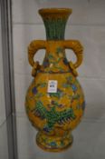 A good large Chinese twin handled vase with incised decoration.
