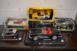 A group of large model cars, boxed.