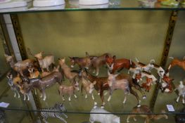 A collection of Beswick horses, ponies, deer and foxes and hounds.