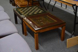 Two brass bound glass top coffee tables, one with medieval style decoration depicting figures and