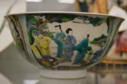 A Chinese famille verte porcelain bowl decorated with figures.