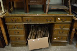 A reproduction pedestal desk.