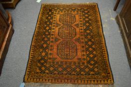 An Afghan gold ground rug, 140cm x 105cm.