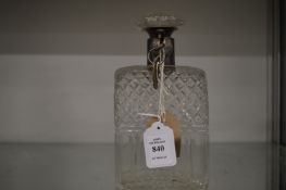 A cut glass whisky decanter with lockable collar and stopper.