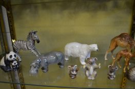 A collection of Beswick wildlife animals to include polar bear, hippo, camels, giraffe, monkeys