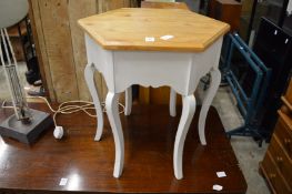 A hexagonal shaped occasional table.