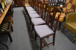 A set of six mahogany stained beech framed dining chairs.
