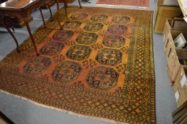 An Afghan gold ground carpet, 300cm x 230cm.