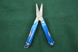 A Leatherman Micra folding multi tool.