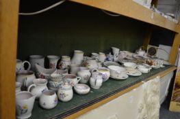 A good collection of Poole pottery to include numerous jugs, bowls, vases etc.