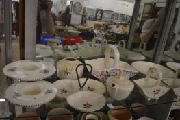 A collection of Poole pottery to include flower baskets, hors d'oeuvres dish etc.