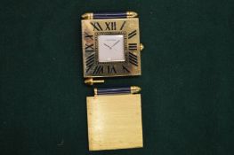 A Cartier folding travelling clock (faults).
