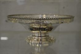A silver pedestal bowl with pierced rim, approx 8 ounces.