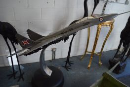 A large metal model of an air force jet on stand, 160cm long.