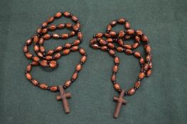 Two rosary bead necklaces.