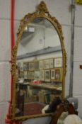 A small gilt framed mirror.