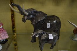 A large Beswick bull elephant and a similar smaller elephant.