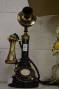 A reproduction candlestick telephone.