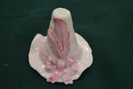 A Royal Worcester candle snuffer in the form of a hat.