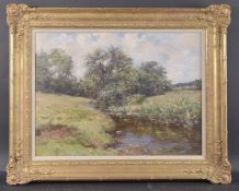 JOSEPH MORRIS HENDERSON (1863-1936) Woodland landscape with stream, oil on canvas, signed, 17.5