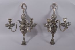 A GOOD PAIR OF OLD SHEFFIELD PLATE TWO-BRANCH WALL LIGHTS with ribbon motifs. 18ins long.