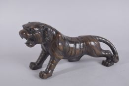 A BRONZE TIGER. 13ins high.