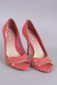 A PAIR OF MIU MIU RED PATENT SHOES, size 36.5. Boxed, some wear.