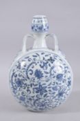 A CHINESE BLUE AND WHITE TWIN-HANDLE MOON FLASK. 33cm high.