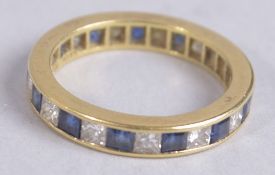 AN 18CT GOLD, SAPPHIRE AND DIAMOND ETERNITY RING.