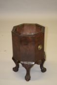 A GEORGIAN STYLE MAHOGANY OCTAGONAL WINE COOLER on claw and ball feet. 1ft 6ins high.