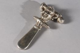 A SILVER JESTER RATTLE.