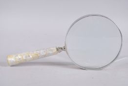 A LARGE MOTHER-OF-PEARL HANDLE MAGNIFYING GLASS. 6ins diameter.