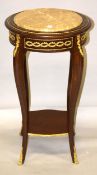 A LOUIS XVI BRONZE MOUNTED CIRCULAR MARBLE TOP STAND on four curving legs with under-tier. 2ft