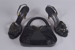 A GIUSEPPE ZANOTTI DESIGN LEATHER SILK BAG, 9ins high, and a pair of shoes, size 38.5, signs of