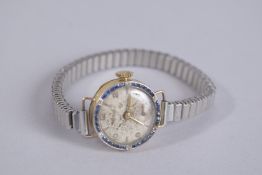 A LADIES GOLD, SAPPHIRE AND DIAMOND COCKTAIL WATCH, dated 1925.