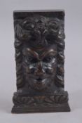 AN EARLY CARVED WOOD GREEN MAN HEAD on a bracket. 9ins x 4ins.