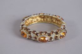 A KENNETH LANE VINTAGE GEM BRACELET, signed, 3ins diameter.