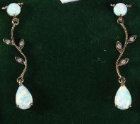A PAIR OF 9CT GOLD, OPAL AND DIAMOND LONG DROP EARRINGS.