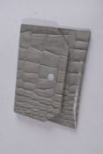 A MAGALI R GREY LEATHER FOLDING PURSE. 4.5ins x 3.5ins.