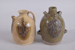 A CHINESE GLAZED POTTERY PAIRING VESSEL, 12.5cm high; together with another (2).