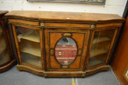 A GOOD VICTORIAN FIGURED WALNUT CREDENZA with central panelled mirrored door flanked by curving