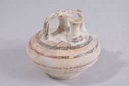 A LATE HELLADIC PERIOD 1300-1200BC STIRRUP JAR decorated with horizonal band, concentric