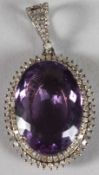 A SILVER SET 27CT AMETHYST AND 1.5CT DIAMOND PENDANT.
