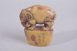 A CHINESE CARVED SOAPSTONE SEAL.