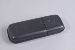 A BLACK LEATHER CIGAR CASE. 7ins x 2.75ins.