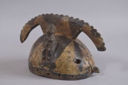 A BURKINA FASO CARVED HELMET MASK. 11ins wide.