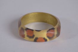 ALEXIS BITTAR. A ZANZIBAR LEOPARD BANGLE, signed, 3ins diameter.